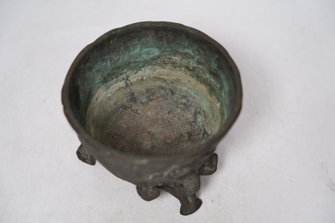 A Japanese bronze tripod censer cast with bats, three character maker’s mark, 12cm in diameter. Condition - fair to good